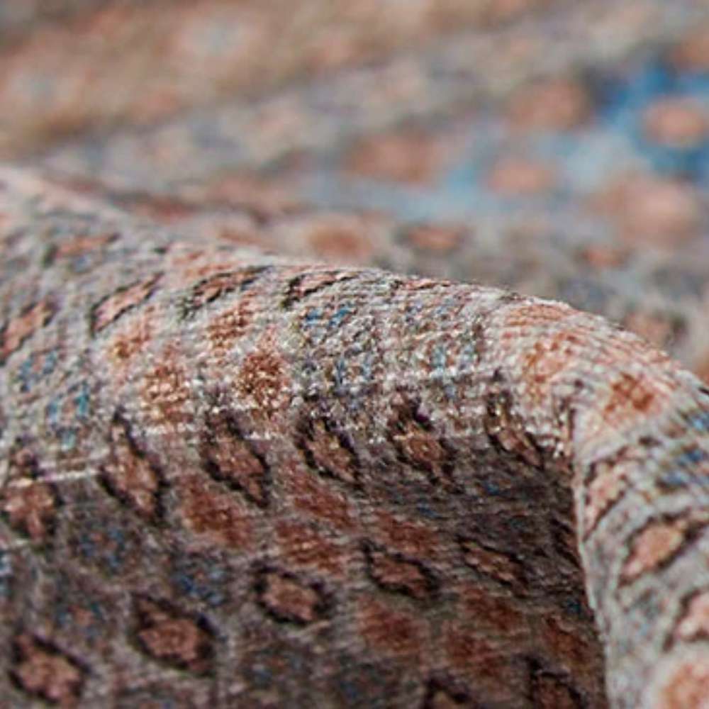 Fabric detail of Momeni Afshar Indoor Rug - AFS34 Blue displays its tightly woven texture and small geometric motifs