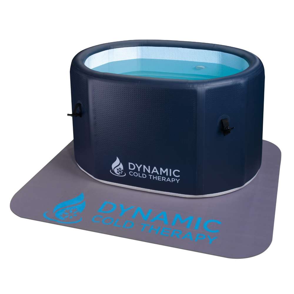 Filled with blue water on a protective mat, Golden Designs Dynamic Cold Therapy Inflatable Oval Cold Plunge features a deep oval tub with padded sides