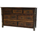 Fireside Lodge Appalachian Seven Drawer Dresser is a rustic dark wood dresser with seven drawers, black metal pulls, and log-style side posts