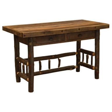 Fireside Lodge Appalachian Two Drawer Writing Desk is a rustic wooden desk with a plank-style top, log legs, and two small drawers underneath