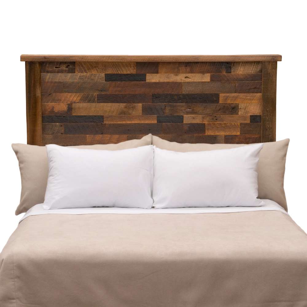 Fireside Lodge Barnwood Americana Headboard appears behind a bed, showing a tall, rustic headboard made from mixed-tone reclaimed wood planks
