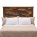 Fireside Lodge Barnwood Americana Headboard appears behind a bed, showing a tall, rustic headboard made from mixed-tone reclaimed wood planks