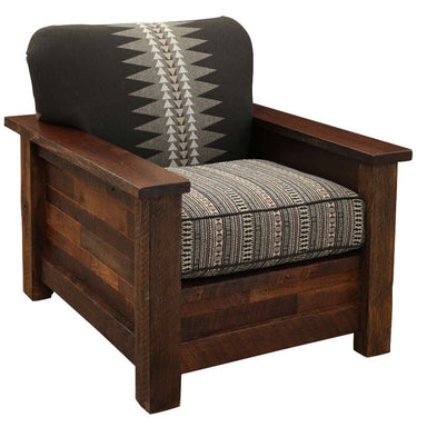 Fireside Lodge Barnwood Americana Lounge Chair is shown from the front with thick wooden arms and patterned cushions that blend geometric designs in black, gray, and beige