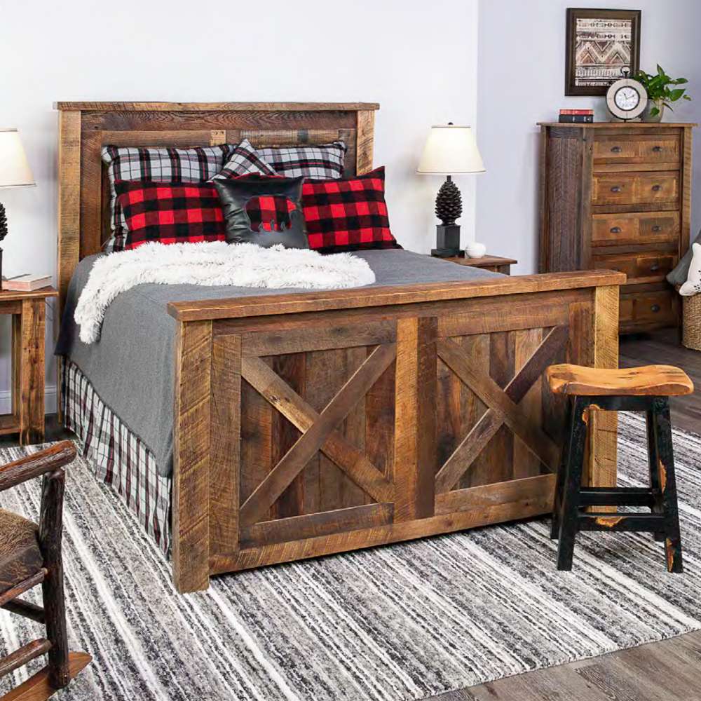 Fireside Lodge Barnwood Barndoor Bed fully set up in a bedroom with a tall wood headboard and matching footboard