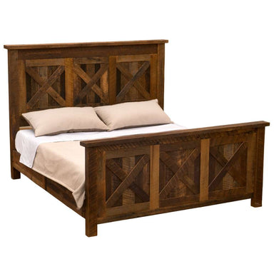 Fireside Lodge Barnwood Barndoor Bed with neutral bedding that contrasts with the dark barnwood frame