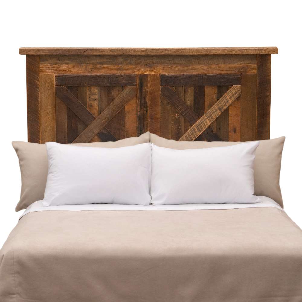 Fireside Lodge Barnwood Barndoor Headboard shown as a rustic reclaimed-wood headboard with a barn door–style panel design behind a neatly made bed