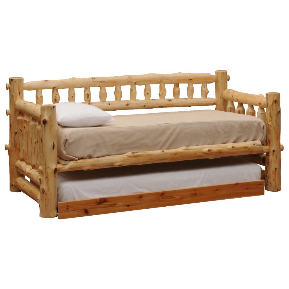 Fireside Lodge Barnwood Daybed With Roll Out Trundle is a rustic log-style wooden daybed with thick posts, a spindle back, a top mattress with pillow, and a pull-out trundle bed underneath