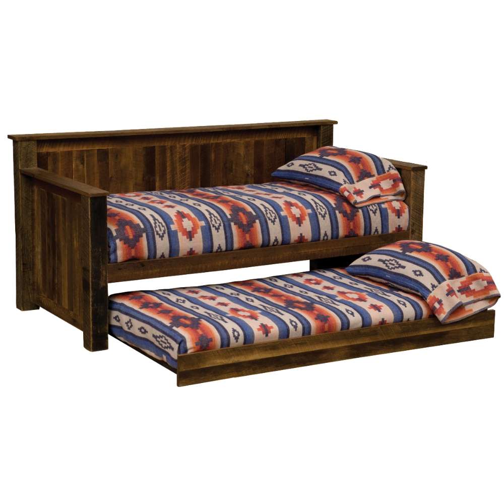 Fireside Lodge Barnwood Daybed With Roll Out Trundle shows both mattresses made up with patterned bedding and the trundle pulled out