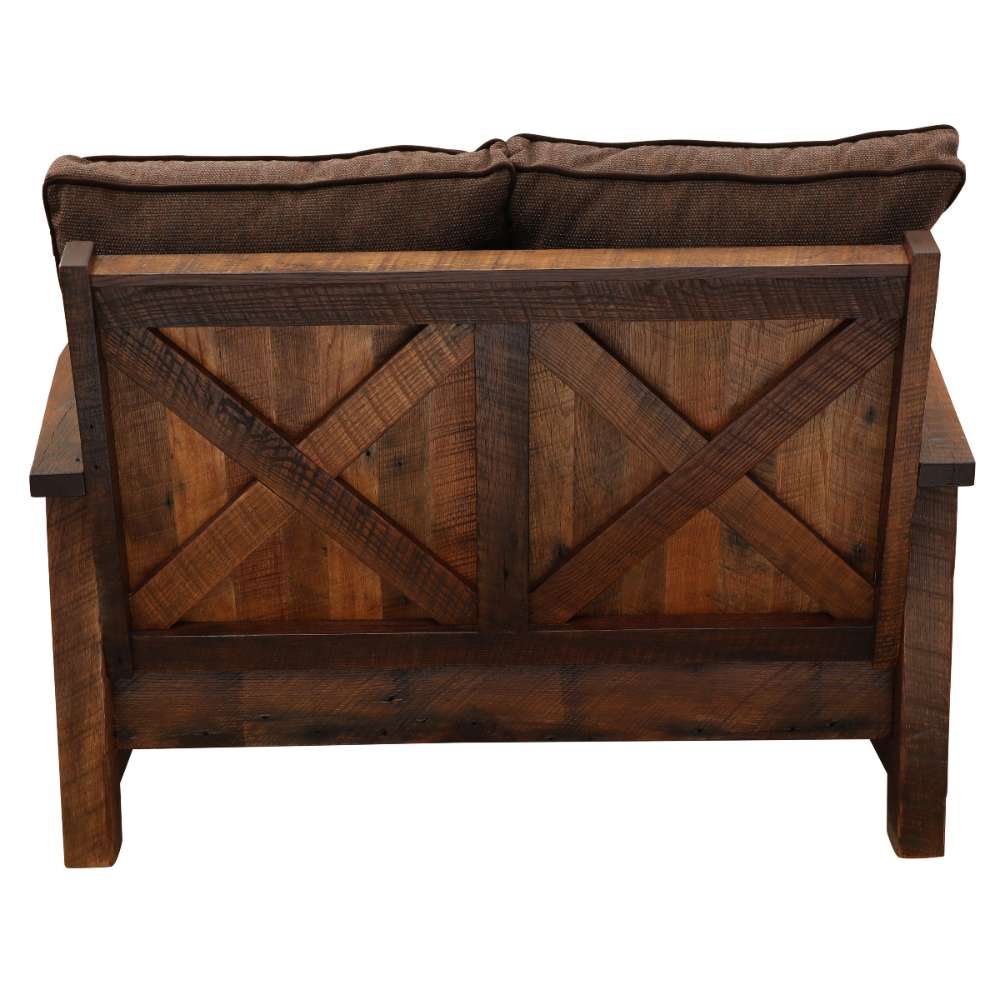 Fireside Lodge Barnwood Loveseat is viewed from the back, displaying a crisscross barn-style wood pattern across its sturdy rear panel