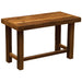 Fireside Lodge Barnwood Open Writing Desk is a rectangular rustic wooden desk with a thick plank-style top, four sturdy square legs, and simple cross supports underneath