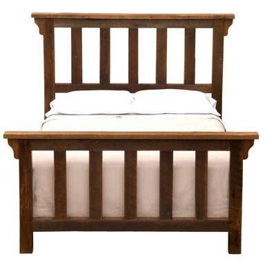 Fireside Lodge Barnwood Post Bed is displayed from the front with a mattress and pillows showing a sturdy wooden headboard and footboard made from reclaimed barnwood