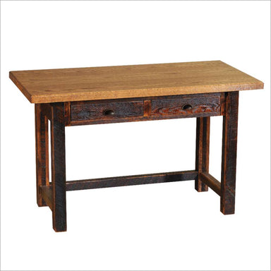 Fireside Lodge Barnwood Two Drawer Writing Desk is a rustic wooden desk with a thick top, two drawers, and sturdy farmhouse-style legs