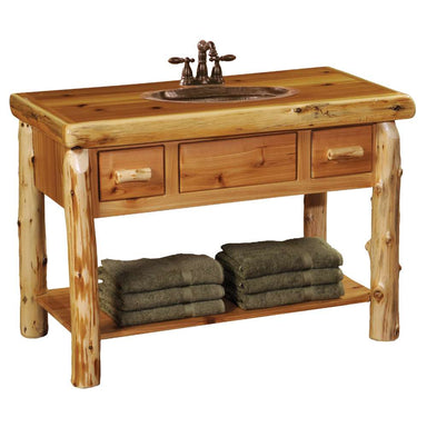 Fireside Lodge Cedar Log Freestanding Vanity with Top is a rustic cedar log bathroom vanity with a built-in sink, three drawers, and a lower shelf for towel storage