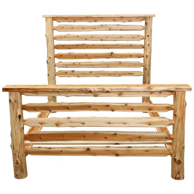 Fireside Lodge Cedar Log Headwaters Bed is shown from the footboard side in light cedar, highlighting the wide log rails and solid posts at the foot of the bed