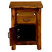 Fireside Lodge Cedar Log Headwaters Enclosed Nightstand shown with the drawer partially open and the cabinet door fully open