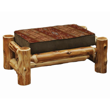 Fireside Lodge Cedar Log Large Ottoman features a sturdy frame made of thick, natural cedar logs with a soft, rectangular cushion on top patterned in warm earthy tones