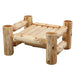 Fireside Lodge Cedar Log Ottoman without its cushion, revealing a flat wooden slat surface supported by four round cedar log legs