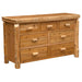 Fireside Lodge Cedar Log Seven Drawer Dresser shown fully assembled with seven closed drawers, a thick log-style top, and rustic cedar wood construction