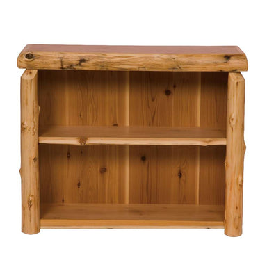 Fireside Lodge Cedar Log Small Bookshelf is shown as a rustic cedar log bookshelf with a natural wood frame, rounded log sides, and two open shelves for storage.