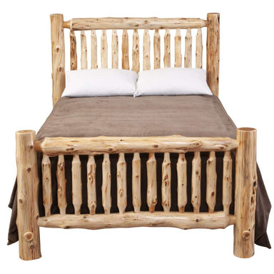 Fireside Lodge Cedar Log Small Spindle Bed is shown from the front with bedding, focusing on the rounded cedar posts and spindle footboard