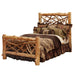 Fireside Lodge Cedar Log Twig Bed shows a rustic log bed with thick cedar posts, a twig-style headboard and footboard, and layered lodge-style bedding