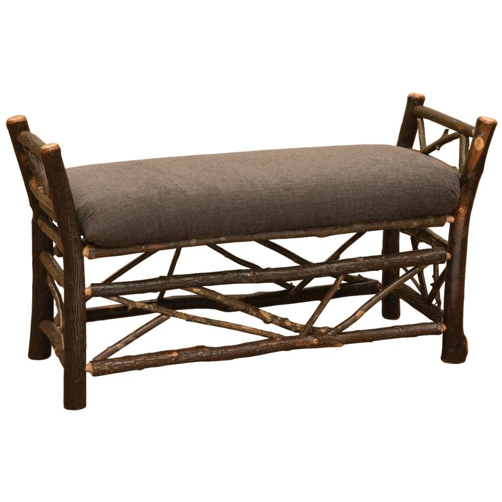 Fireside Lodge Hickory Log Bedside Bench with Twig Accent is a rustic hickory log bench with twig detailing and a cushioned brown seat