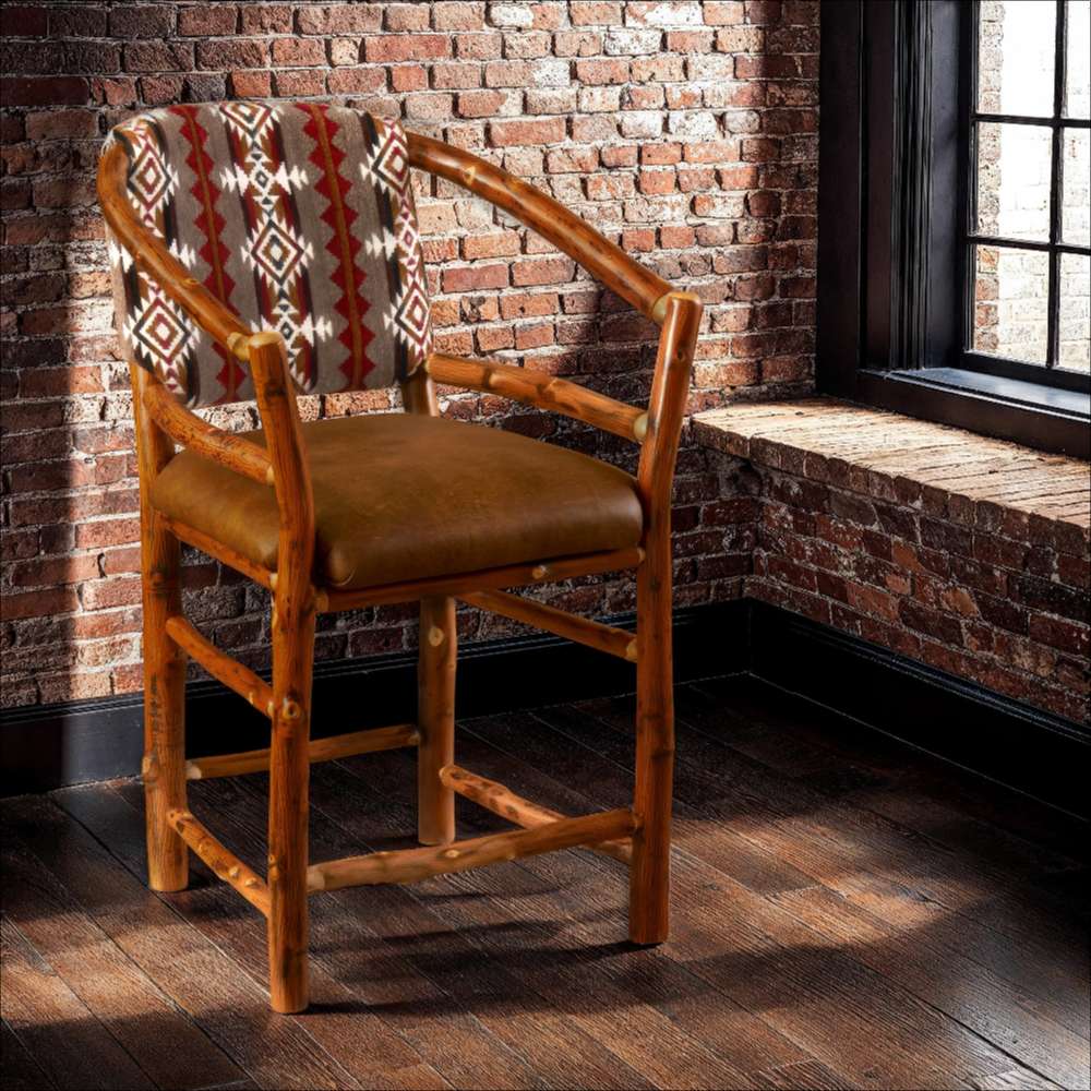 Fireside Lodge Hickory Log Hoop Counter Stool with Back is a rustic hickory log stool with a leather seat and Southwestern-patterned back, set in a cozy brick room
