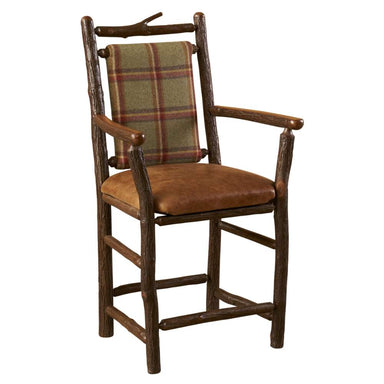 Fireside Lodge Hickory Log South Fork Counter Stool with Arms is a rustic hickory log counter stool with a brown leather seat and plaid backrest, shown at an angle