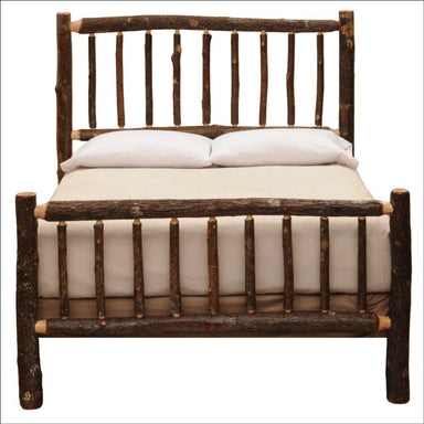 Fireside Lodge Hickory Log Traditional Bed is shown fully assembled with a rustic log headboard and footboard holding a neatly made mattress