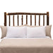 Fireside Lodge Hickory Log Traditional Headboard shown as a rustic headboard made from natural hickory logs with visible knots behind neatly arranged pillows