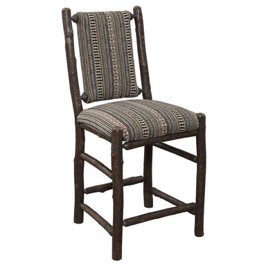 Fireside Lodge Hickory Log Upholstered Counter Stool features a rustic hickory log frame with a cushioned seat and back in earth-toned patterned fabric