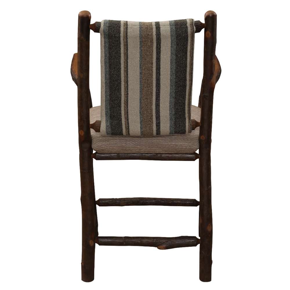 Fireside Lodge Hickory Log Upholstered Counter Stool with Arms highlights natural log posts, strong crossbars, and a tall striped fabric back for rustic style and support