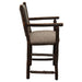 Fireside Lodge Hickory Log Upholstered Counter Stool with Arms shows a sturdy hickory log base with stretchers, smooth armrests, and a comfortable padded seat and backrest