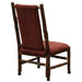 Fireside Lodge Hickory Log Upholstered Executive Chair With Casters is shown from a rear angle, highlighting the cushioned seat, log frame, and rolling casters