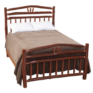 Fireside Lodge Hickory Log Wagon Wheel Bed is shown neatly made on a white background with a rounded hickory log footboard