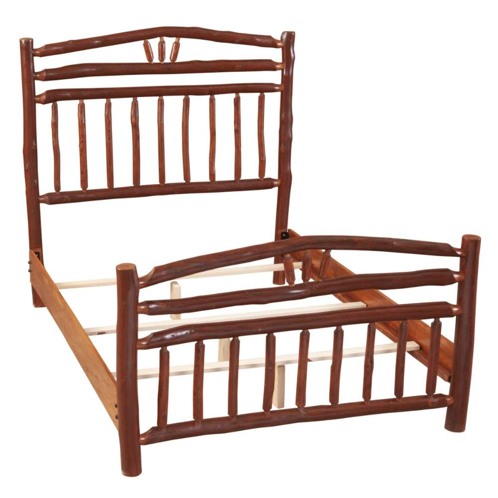 Fireside Lodge Hickory Log Wagon Wheel Bed is shown partially assembled, revealing its thick log posts and support rails