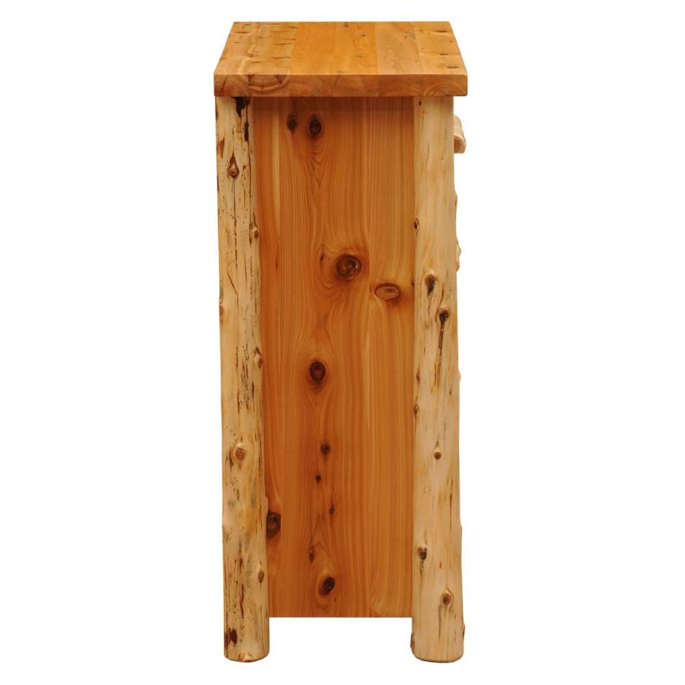 Fireside Lodge Voyageur Four Drawer Chest is seen from the side, emphasizing the natural wood knots and rustic log corner posts