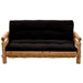 Fireside Lodge Voyageur Futon as a rustic log-frame sofa with a thick black cushion and sturdy rounded wooden armrests