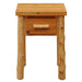 Fireside Lodge Voyageur One Drawer Nightstand shown from the front with a rustic wood top, log legs, and one drawer