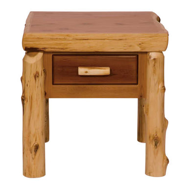 Fireside Lodge One Drawer End Table is a rustic wooden table featuring a thick, natural wood slab top, sturdy log legs, and a single drawer with a handcrafted log pull