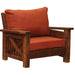 Fireside Lodge Barnwood Chair-And-A-Half is a wide rustic armchair made of reclaimed wood with thick, burnt-orange cushions