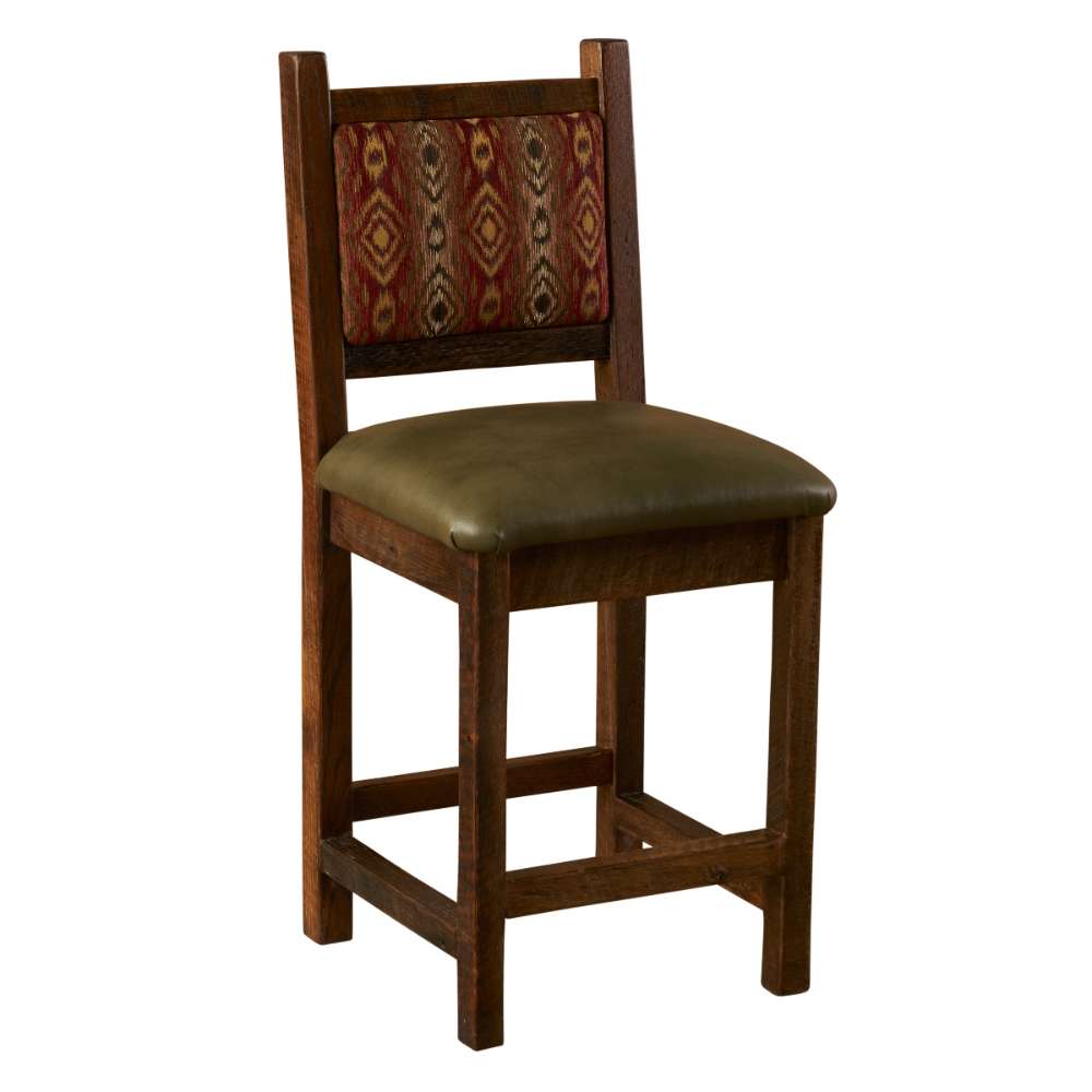 Fireside Lodge Barnwood Colonial Counter Stool shows its angled view with a sturdy wood frame, green seat, and decorative backrest