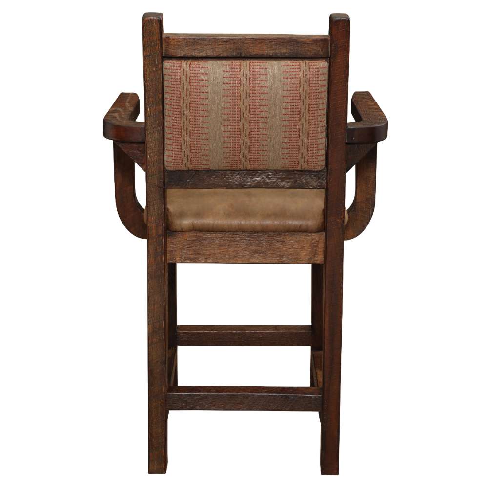 Fireside Lodge Barnwood Colonial Counter Stool with Arms displays its back view, revealing a patterned fabric backrest framed by rich, dark reclaimed wood