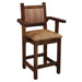 Fireside Lodge Barnwood Colonial Counter Stool with Arms is seen at an angle, showing its solid craftsmanship, warm tones, and blend of comfort and rustic charm