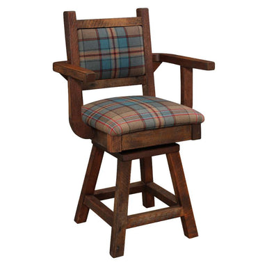 Fireside Lodge Barnwood Colonial Swivel Counter Stool with Arms is shown from a diagonal angle, emphasizing its reclaimed wood texture and comfortable plaid upholstery