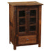 Fireside Lodge Barnwood Media Cabinet is a small rustic wooden cabinet with two glass doors and a lower drawer