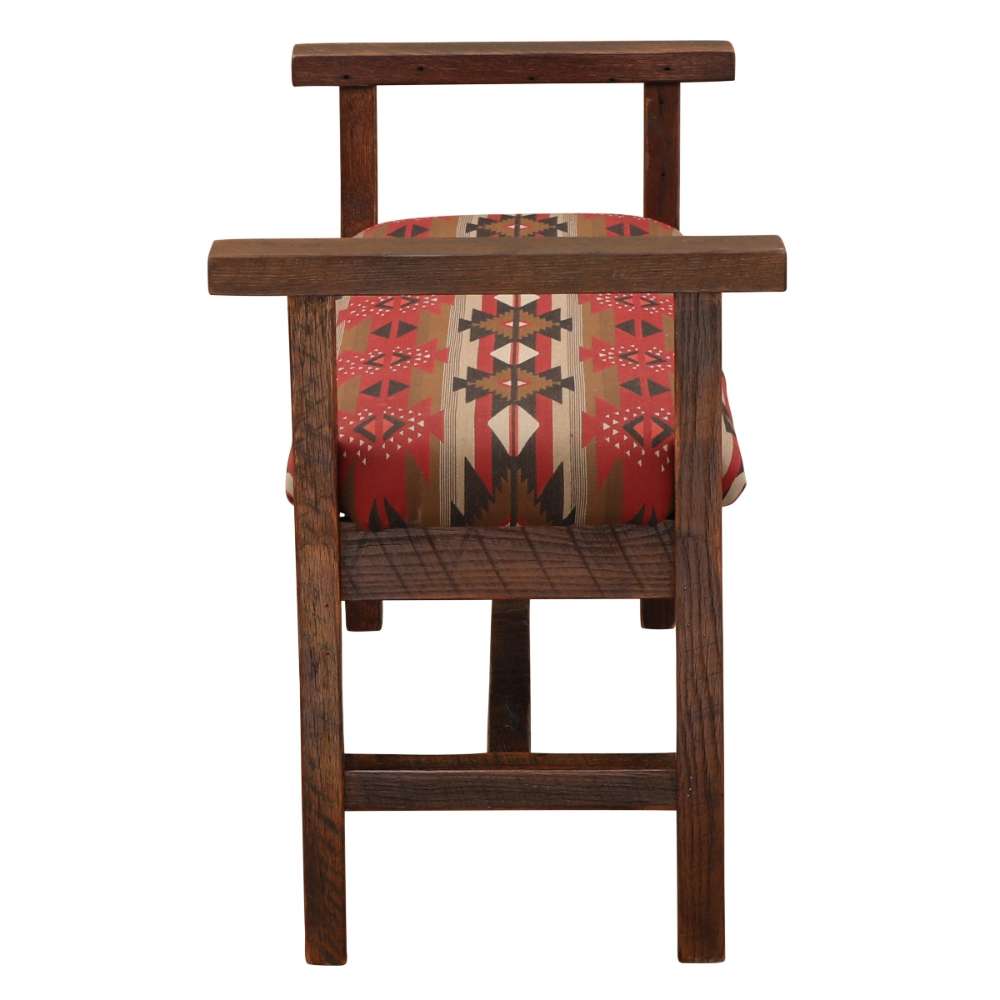 Fireside Lodge Barnwood Upholstered Bench with Arms is shown from the side highlighting its thick wooden structure and the vibrant geometric pattern on the cushioned seat