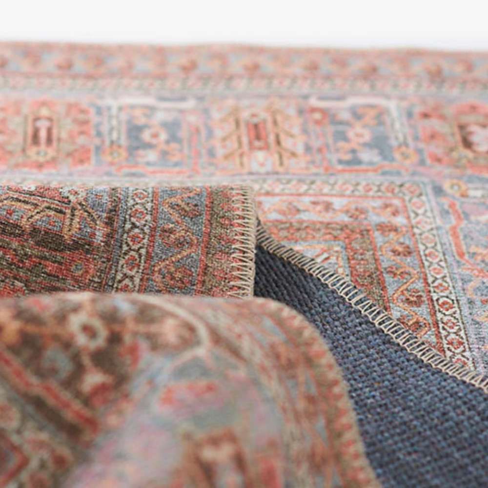 Folded edge of Momeni Afshar Indoor Rug - AFS38 Copper revealing the strong backing and intricate border design