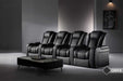 Four onyx Valencia Tuscany Luxury Edition Home Theater Seating chairs are arranged in a contemporary, dimly-lit room