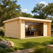 Rectangular light wood ALU Concept 70I studio with large glass sliding doors on a grassy lawn surrounded by trees.